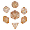 A set of seven resin polyhedral dice, including a d12 and d20, displayed in clear acrylic frames.