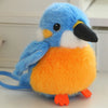 A fluffy blue and orange cartoon bird plush with a black beak and blue tail.