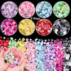 A collection of colorful acrylic beads and gems in various shades and shapes for DIY jewelry making.
