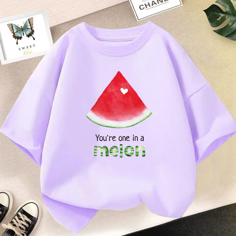 Light purple graphic t-shirt featuring a red watermelon slice design and the text You're one in a melon.