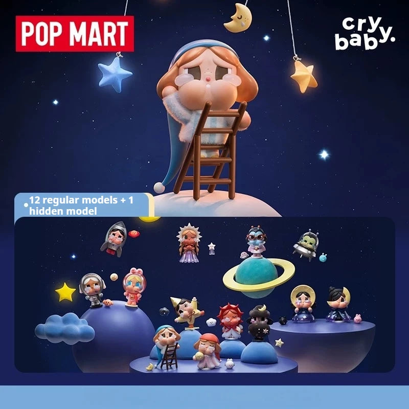 A POP MART collectible figurine of a crying baby character with a ladder and stars, displayed against a dark blue background.