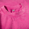A close-up of a bright pink men's retro washed heavyweight cotton t-shirt with a crew neck collar.