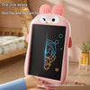 A pink LCD writing tablet for kids is shown with a hand writing on the screen in a bright indoor setting.