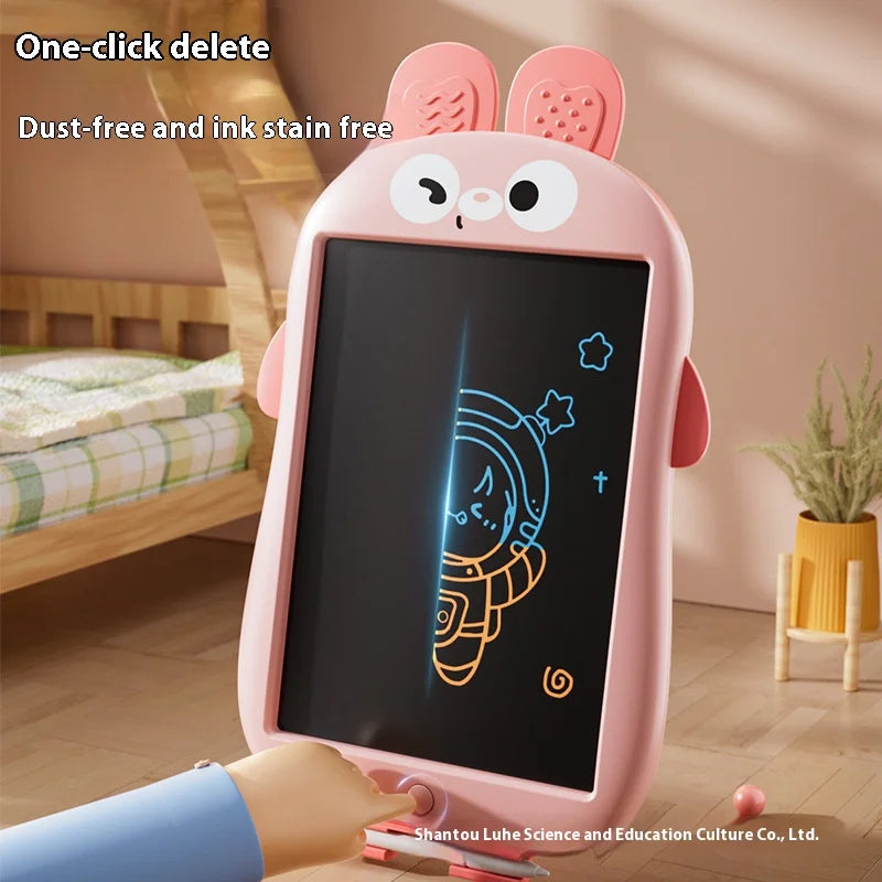 A pink LCD writing tablet for kids is shown with a hand writing on the screen in a bright indoor setting.