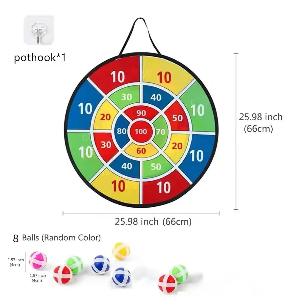 A circular dartboard with colored segments and a hanging mechanism, shown next to several small balls.