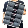 A pack of five balls of gray alpaca wool yarn for knitting and crochet.