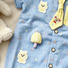 Light blue baby boy short-sleeve romper with yellow bear and mushroom appliqués