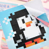A square grid of black and white tiles forming a cartoon penguin face on a light blue background.