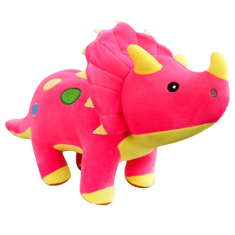 A bright pink dinosaur plush toy with yellow accents and green details.