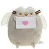 A soft gray plush cat toy with white wings holding a pink envelope.