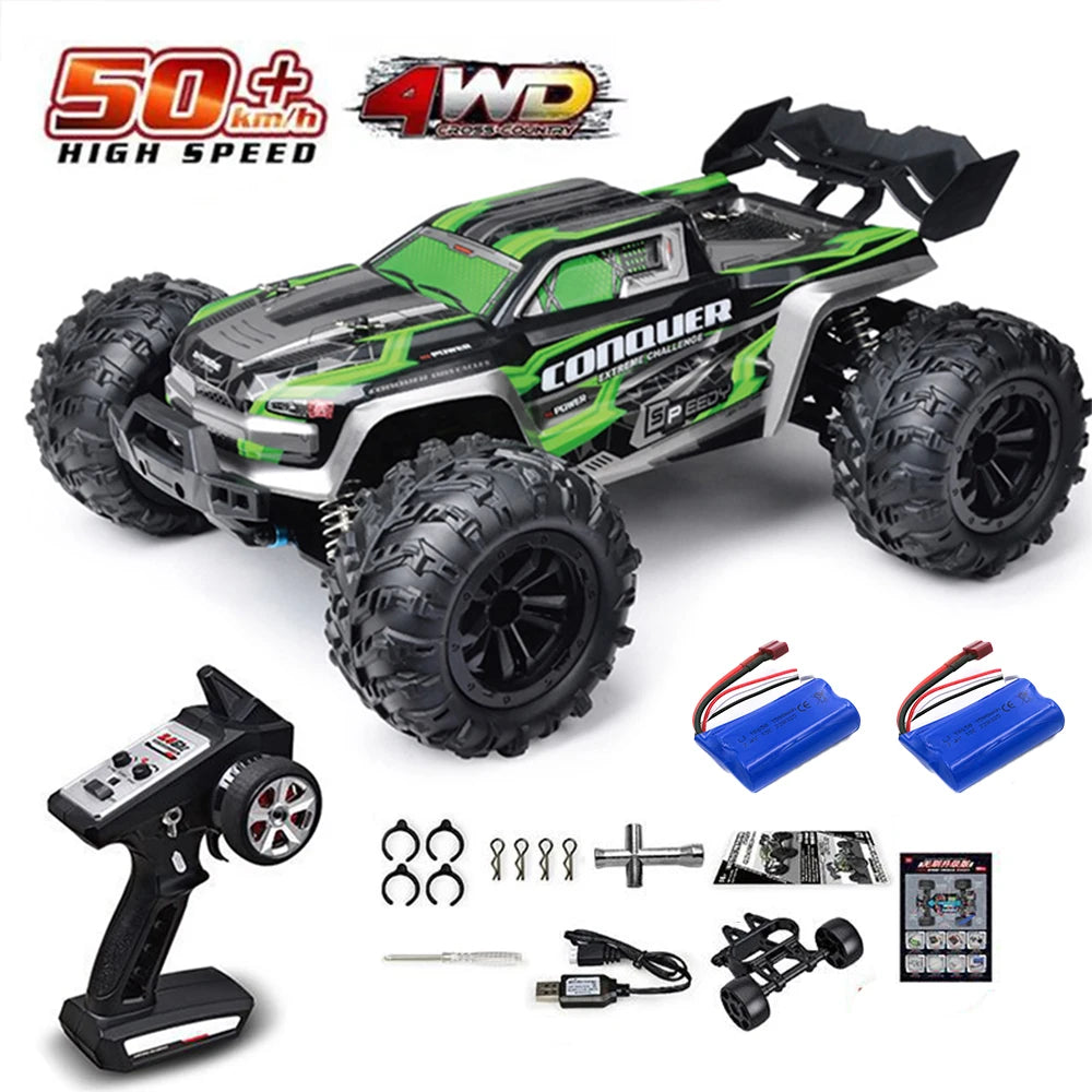 A green and black brushless 4WD monster truck RC car with large tires and accessories.