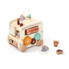 A wooden animal tourism bus Montessori busy board with various animal figures and components for toddlers.
