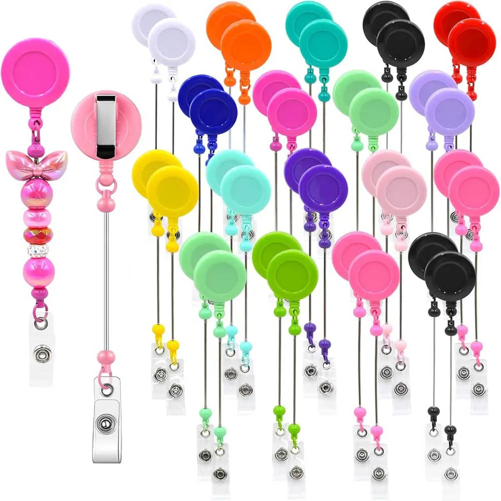 A set of colorful beadable badge reels with retractable clips displayed vertically.
