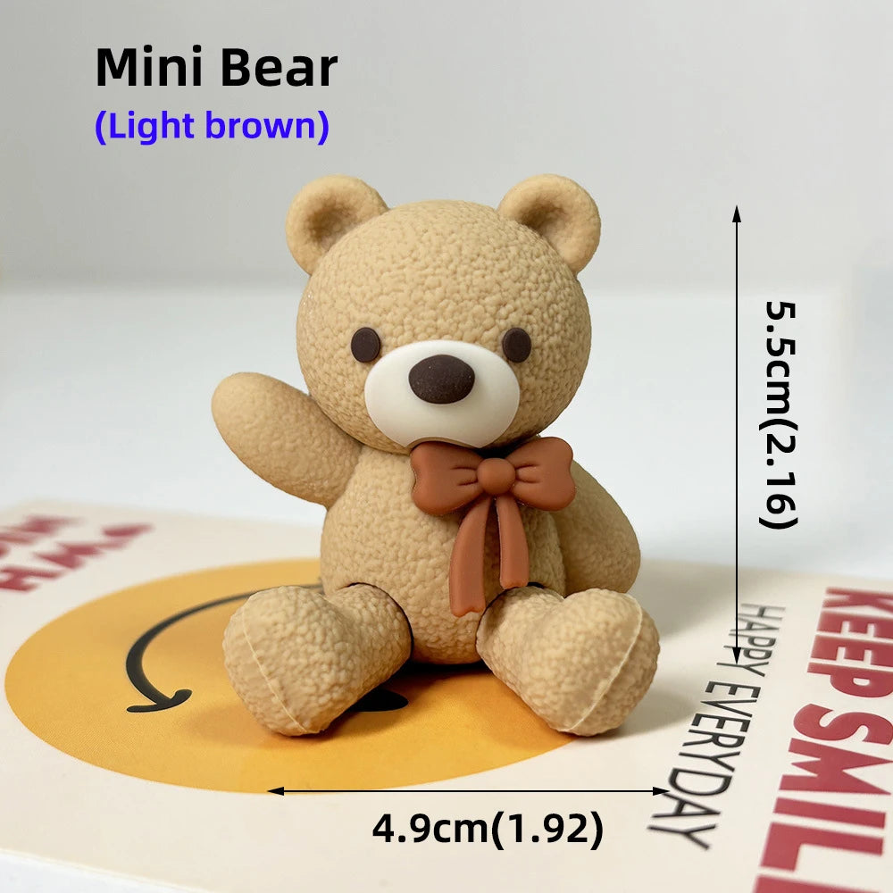 A light brown Mini Bear stuffed toy sitting on a card with measurements.