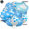 A bunch of blue and white foil balloons shaped like clouds and planes for birthday party decor