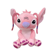 A pink plush figurine of a donkey character with large eyes and purple accents.