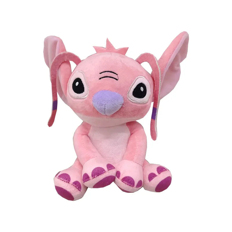 A pink plush figurine of a donkey character with large eyes and purple accents.