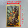 A golden foil tarot card depicting the Queen of Cups, measuring 7cm thick.