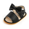 Black leather baby summer sandals with a bowknot and soft anti-slip sole