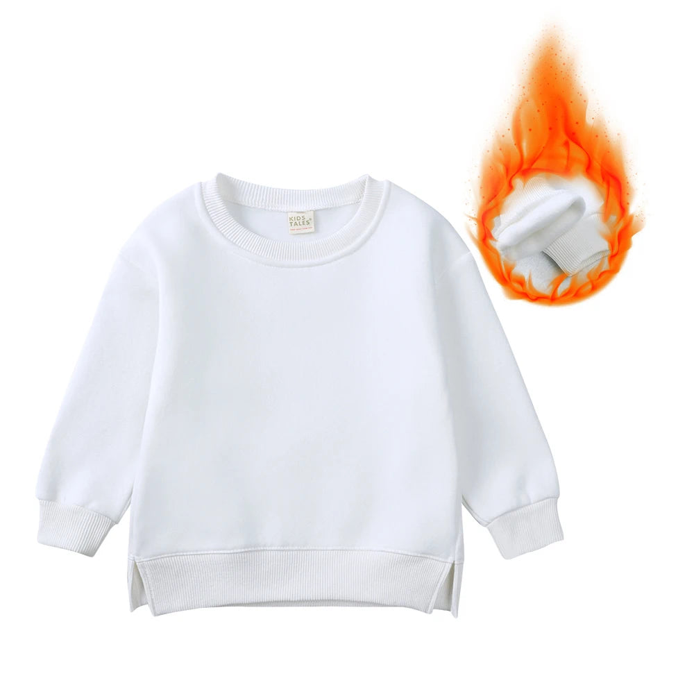 White kids pullover hoodie with a small tag and an orange flame graphic