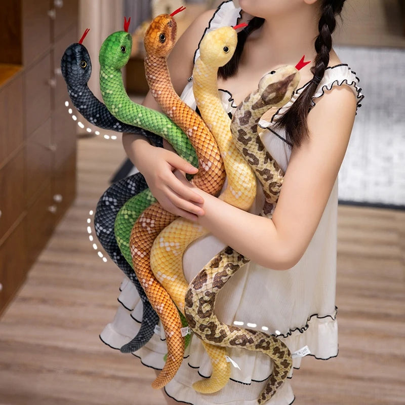 A girl is holding several lifelike simulation snake plush toys of various colors and patterns.