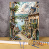 Paint by numbers kit depicting a flower field and wooden house landscape with lush greenery and stone architecture