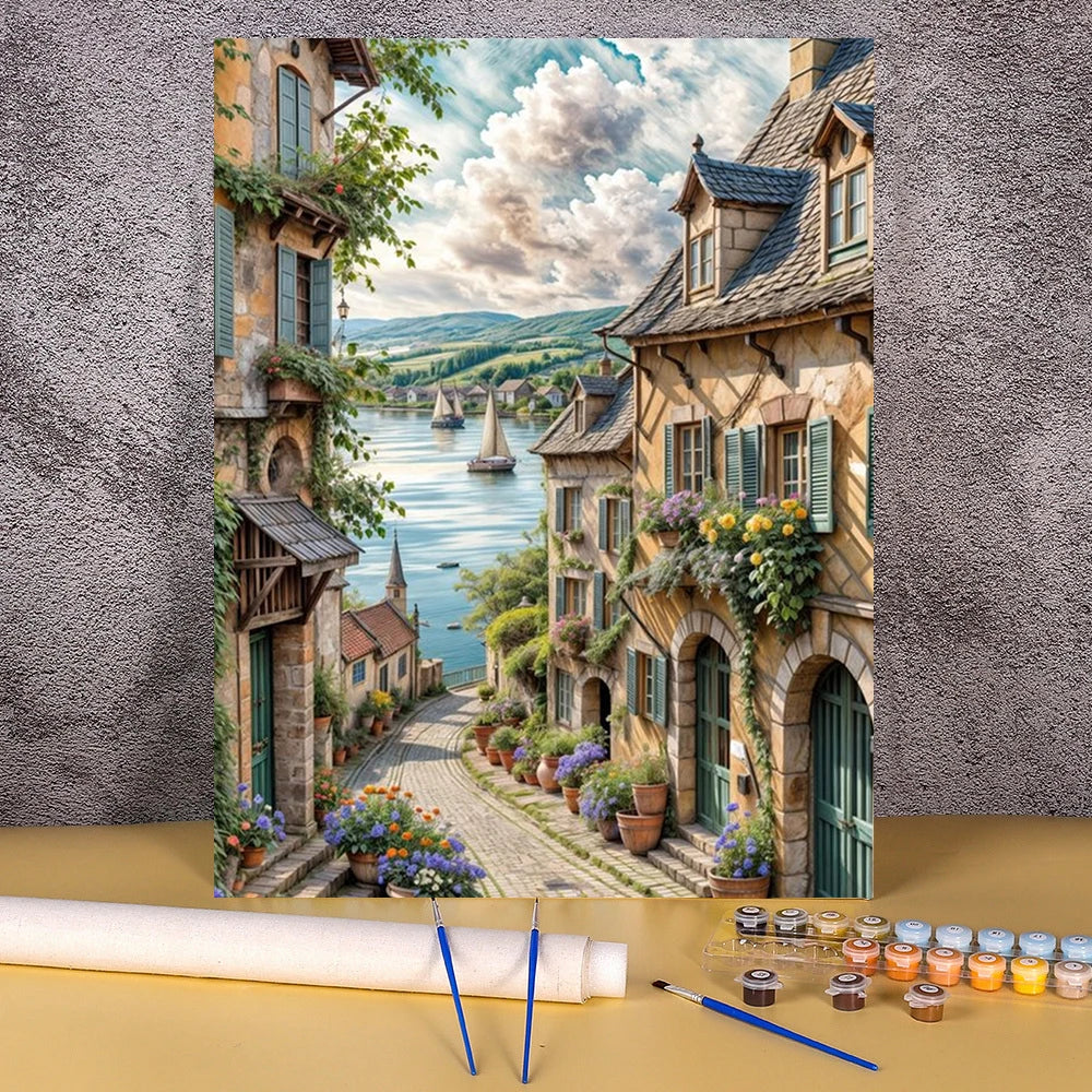 Paint by numbers kit depicting a flower field and wooden house landscape with lush greenery and stone architecture