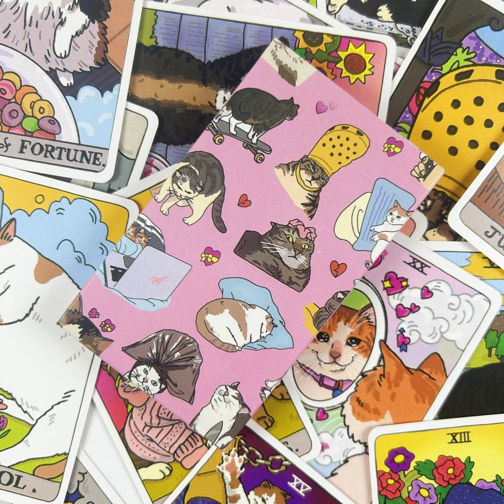 A collection of colorful cat meme tarot oracle cards featuring various feline illustrations and mystical themes.