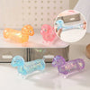 A collection of squishy stress relief toys shaped like dachshunds in various colors including orange pink blue and purple.