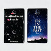 A set of black and dark blue oracle cards featuring mystical moon imagery and text on the cover.