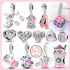 A collection of 925 sterling silver heart charm beads and animal charms in pink and silver tones.