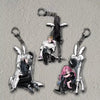 A set of acrylic figures featuring anime characters in various poses and outfits.
