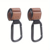 A pair of brown heavy-duty stroller hooks designed for hands-free organization.