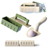 A set of beach sand castle building tools including a wooden mold, a green plastic tray, and a pink ball.