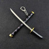 A samurai sword keychain with a silver blade and black grip featuring a repeating pattern of small geometric shapes.
