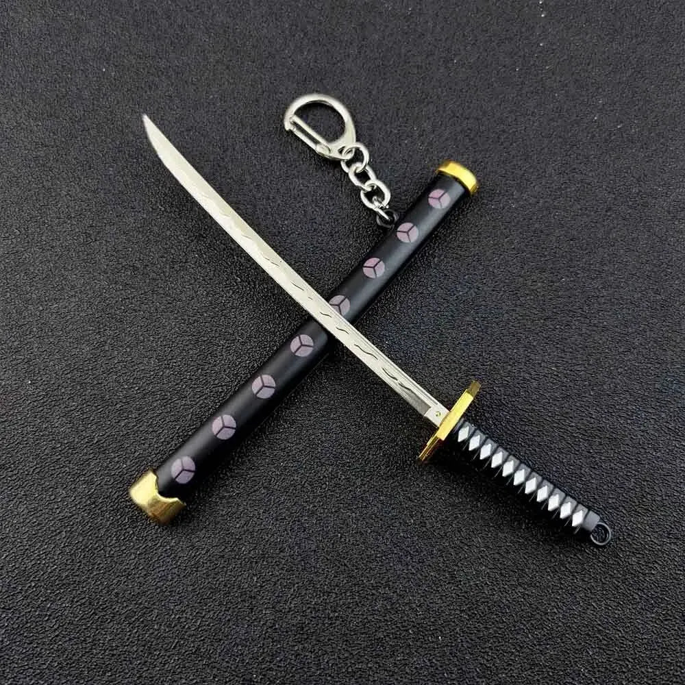 A samurai sword keychain with a silver blade and black grip featuring a repeating pattern of small geometric shapes.
