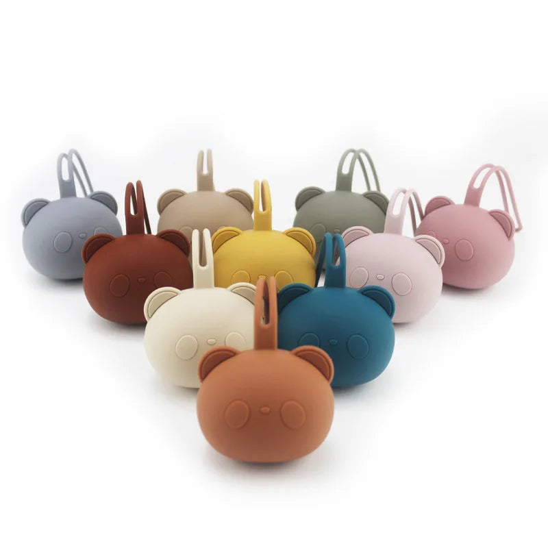 A collection of various colored food-grade silicone panda-themed pacifier storage bags.