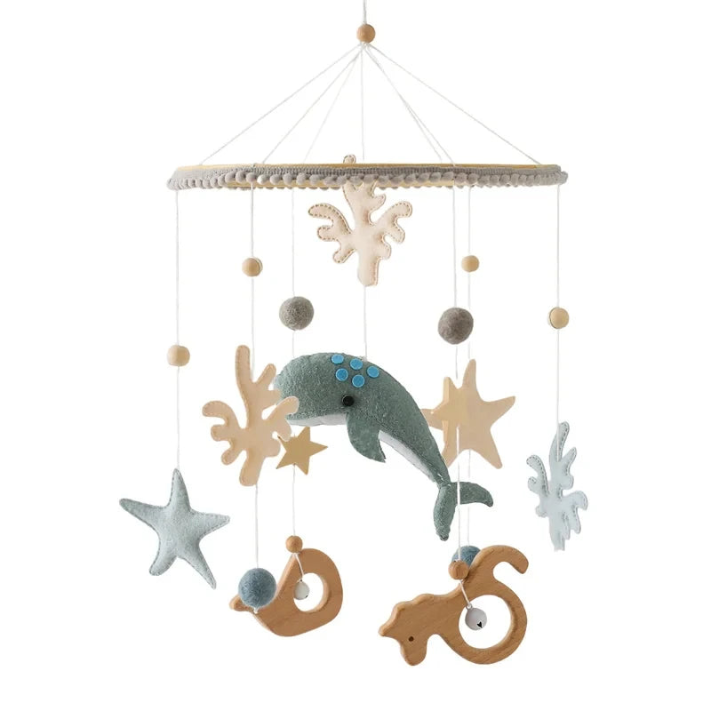 Wooden felt forest animal crib mobile featuring various wooden and felt animals hanging from a string