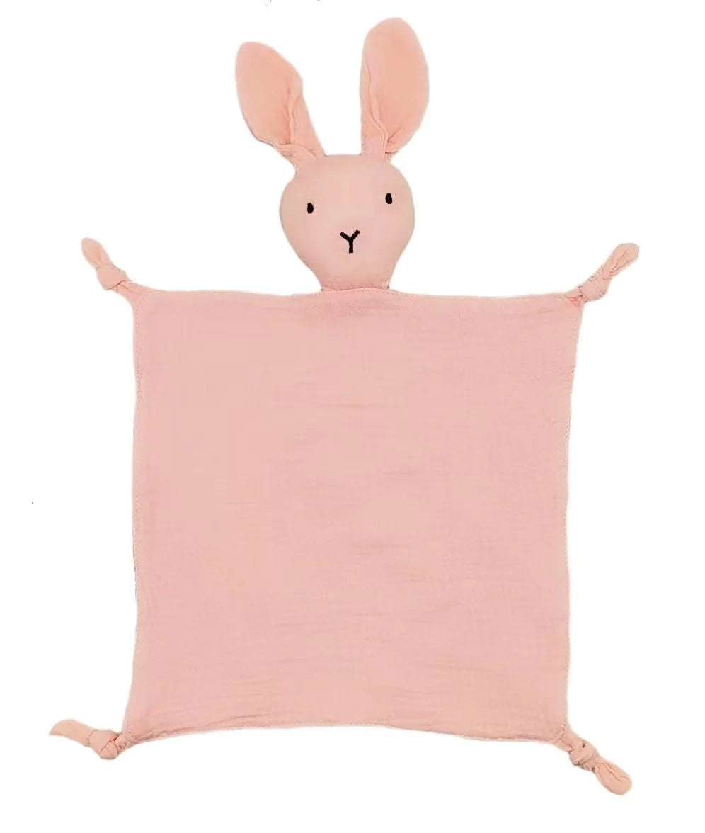 A pink bunny shaped muslin comforter blanket for a baby