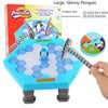 A blue penguin ice table game with wooden sticks and a box showing the product details.
