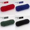 A collection of five skeins of yarn in red, denim blue, army green, and black, shown rolled for knitting or crochet.