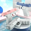 A collection of white and pink high-pressure water blasters are displayed on a surface.