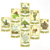 A spread of nine Lenormand oracle cards featuring various symbols like a deer, a tree, and a ship.