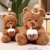 A brown teddy bear plush toy with a birthday hat and an eye mask accessory sitting on a light surface.