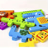 A colorful wooden tangram puzzle set featuring various animal shapes like a tiger, elephant, and dinosaur.