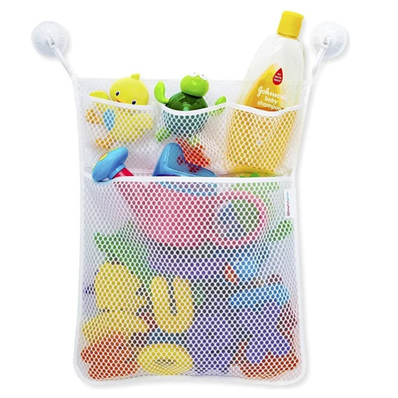 A white mesh storage bag with suction cups holds various yellow and green duck and frog toys.