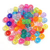 A pile of 200 colorful pony beads in various shades including pink, purple, green, yellow, and orange.