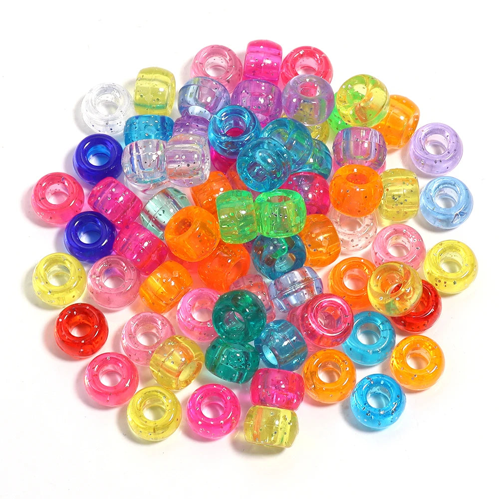 A pile of 200 colorful pony beads in various shades including pink, purple, green, yellow, and orange.