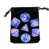 A set of polyhedral dice, including a d20 and d8, stored in a black fabric pouch.