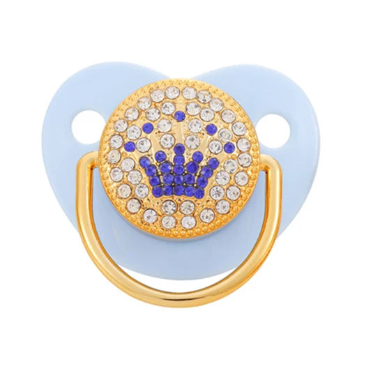 Rose gold crystal bling pacifier with a gold crown design and light blue silicone ring